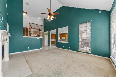 Unfurnished living room with high vaulted ceiling,