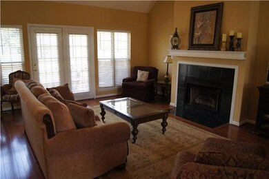 Soaring ceilings and tons of windows in this living room