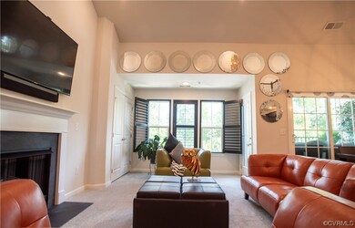 Expansive great room features vaulted ceilings and