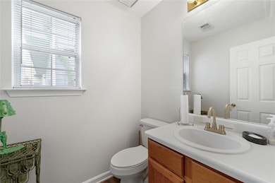 Half bath with toilet and vanity