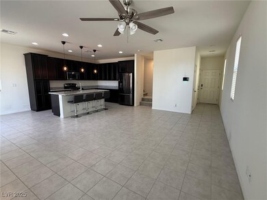 Kitchen with freestanding refrigerator, stainless