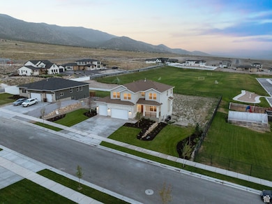 Aerial view showing the mountain backdrop and .50 acre lot.
