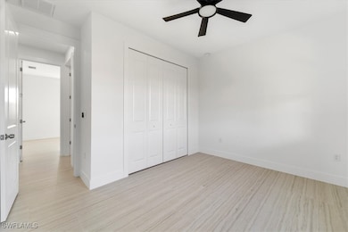 Unfurnished bedroom with light wood-style flooring