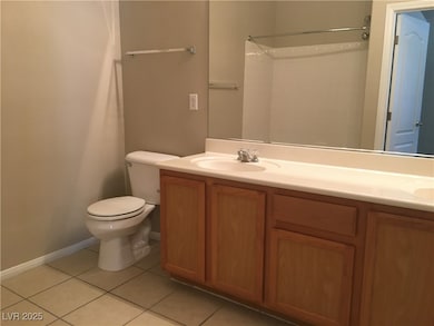 Bathroom featuring tile patterned floors, double v