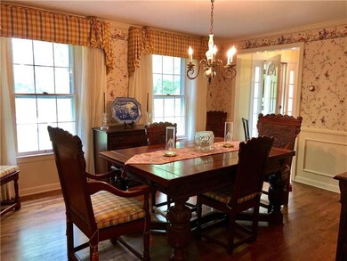 The formal dining room has beautiful moldings and 