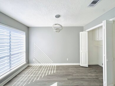 Adjacent to the kitchen, this elegant dining space
