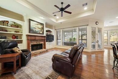 Living room invites you into the home. Notice all of the windows and natural lighting throughout the house.