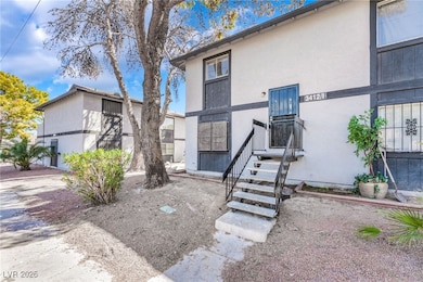 Rear view of property with stucco siding