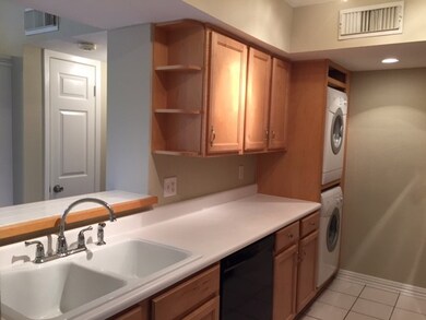 Kitchen with stackable washer and dryer