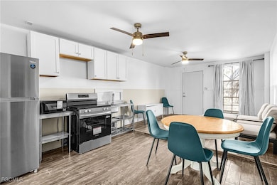 Dining area featuring light wood-style flooring and a ceiling fan