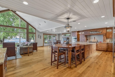 Inside, you’ll be greeted by custom woodwork, Andersen windows throughout, built-in speakers, and motorized shades that bring both luxury and ease.