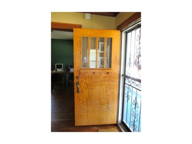 Beautiful solid wood front door w/ glass.