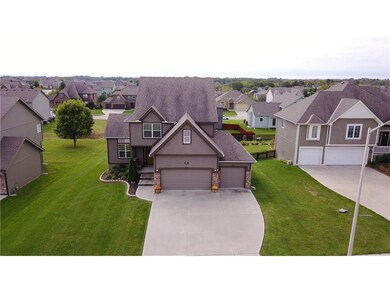 Ariel view of the large lot. Landscaped with a 3 c