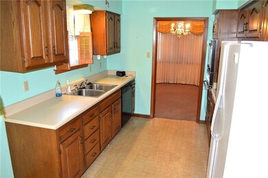 Newer kitchen cabinets.  Dining area beyond.