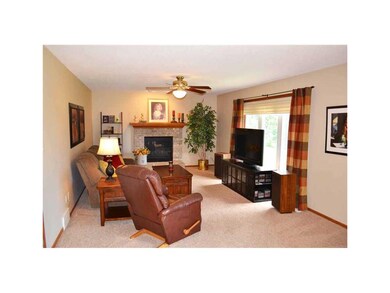 Great Room. Newer carpet and brick fireplace