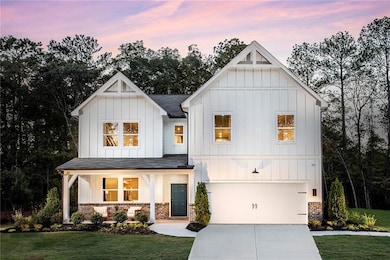 View of front facade featuring a yard, a porch, an