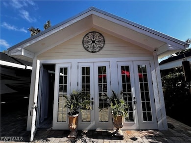 View of outbuilding featuring french doors