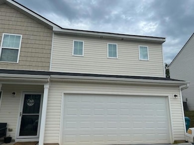 View of front of home featuring a garage
