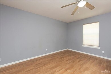 Unfurnished room with ceiling fan and light hardwood / wood-style flooring