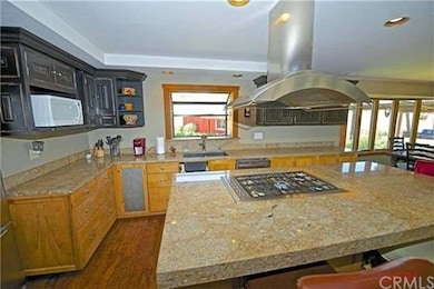 GOURMET KITCHEN WITH GORGEOUS GRANITE SLABS AND HI