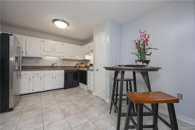 Eat in kitchen with solid surface counters and til