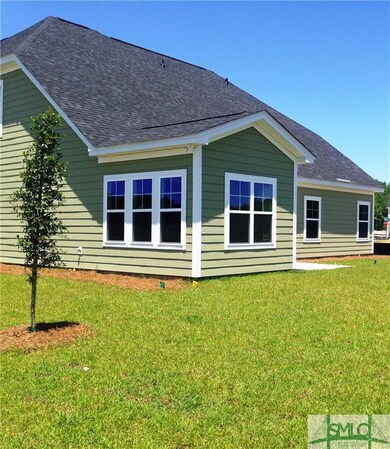 Exterior view of sunroom. Sprinkler system for who