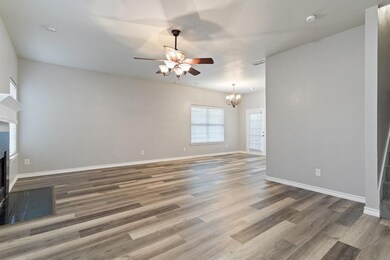Unfurnished room featuring french doors, dark hard
