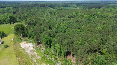 View of property location featuring a heavily wooded area