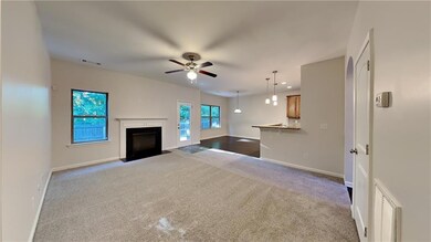 Unfurnished living room with carpet flooring and c