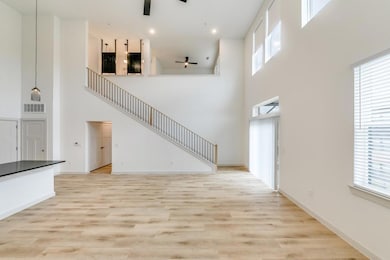 Unfurnished living room with baseboards, visible v