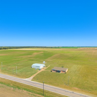 Aerial view of the 5 acre property, 50x30 Barn, Land and Home!