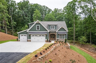 Craftsman inspired home featuring driveway, board and batten siding, a shingled roof, and an attached garage