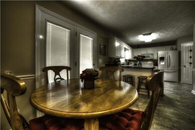 The eat in kitchen,, has double doors to exit into the back yard
