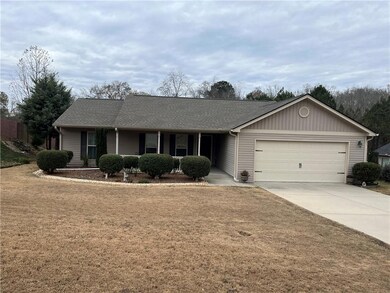 Ranch-style house featuring covered porch, a front