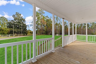Porch featuring a yard