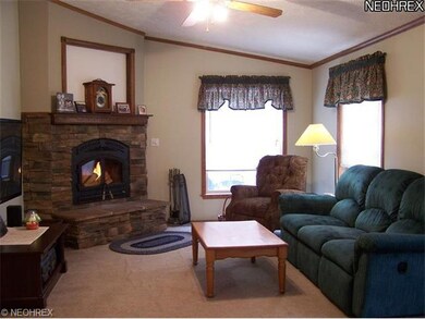 Family room with wood burning fireplace.