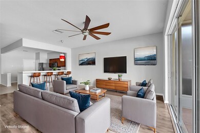 The kitchen opens seamlessly into the Living room/Dining room area.