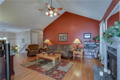 Living room with marble surround fireplace with gas logs