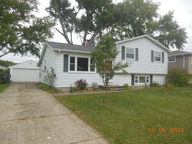 N side with detached garage