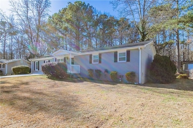 Ranch-style house featuring a front lawn