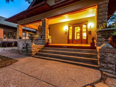 The porch is grand and welcoming