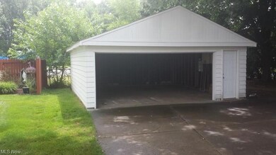 Garage with new roof and doors. Playground in the 