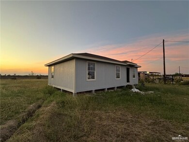 View of property exterior at dusk