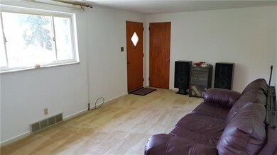 Large well lit Living room with Hardwood under the