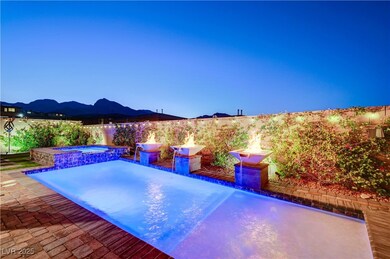 View of pool with a fenced backyard and a pool wit