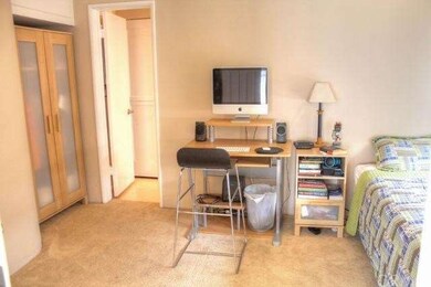 Bedroom with cove for armoire in addition to close