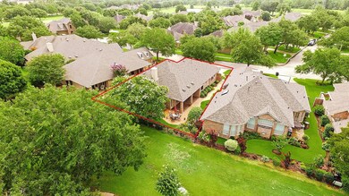 An aerial view of the home highlighted in red. The