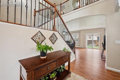 Tile Entry with Garage Access and Vaulted Ceilings