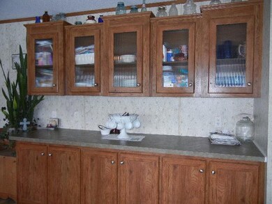 Loads of space!!!  This lovely kitchen buffet is the perfect serving area for entertaining with see-through cabinetry to display your collectibles.
