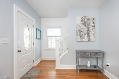 Foyer entrance featuring light hardwood / wood-style floors